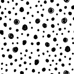 Dot doodles seamless pattern. Hand drawn circles texture background.