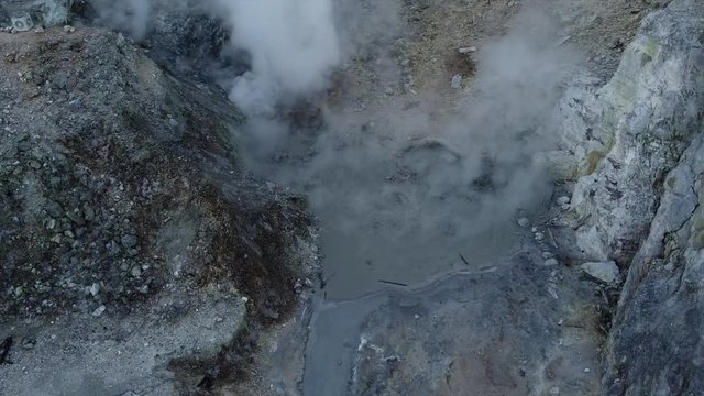 Aerial view pan of Volcanic Activity Boiling Geothermal Mud