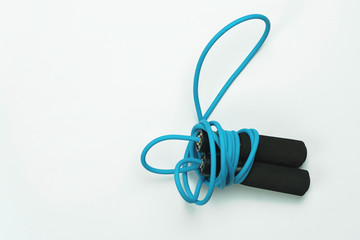 Obraz premium blue and black Jumping rope on white background sport fitness..