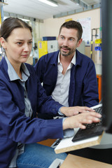 female engineer typing on computer keyboard