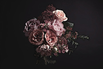 Beautiful bouquet on black background. Floral card design with dark vintage effect