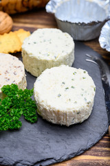 Spread cream cheese with herbs, garlic, chives and spices close up