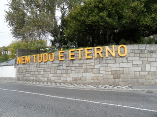 wall with the phrase "not everything is eternal", in the city of Guimarães, Portugal. Translation - not everything is eternal.