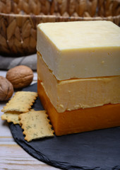 Leicestershire cheese or red leicester and mature cheddar, variety of British hard cheeses made from cow milk