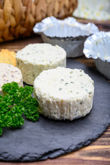 Spread cream cheese with herbs, garlic, chives and spices close up