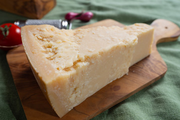 One piece of authentic Parmigiano-Reggiano or Parmesan Italian hard, granular cheese