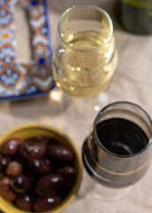 Fortified wine from Andalusia, Spain, different types of sherry in glasses and olives, colors of Andalusisa