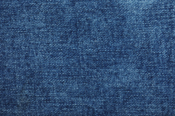 Texture of dark blue jeans as background, closeup