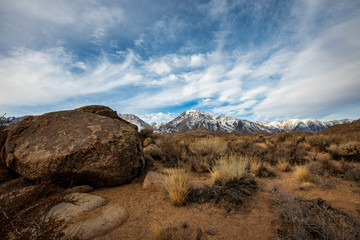 snowy Sierra Nevada mountains and rock formations in a region known as The Buttermilks near Bishop, California