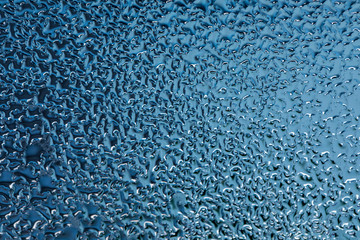 Close up texture of frozen water drops cool ice glass