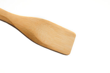Wooden spatula from kitchen utensils on a white background