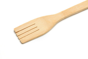 Wooden fork from kitchen utensils on a white background