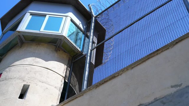 barbed-wire prison observation tower