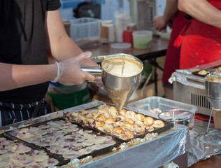 Cooking takoyaki on open air