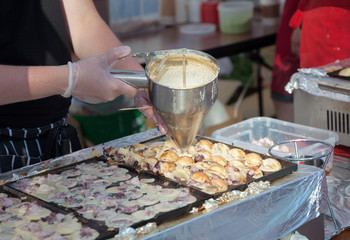 Cooking takoyaki on open air