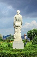 Fototapeta na wymiar Rear view of a stone statue of a naked woman in Miramar on Mount Montjuïc. Barcelona, ​​Spain