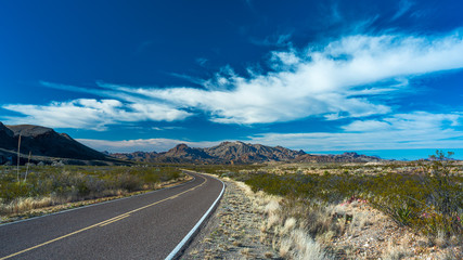 Road Leading to Desert Mountins