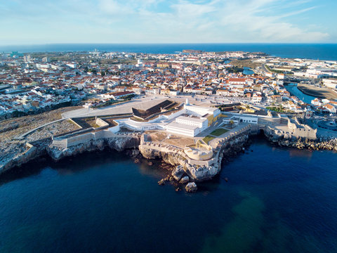 Aerial View Of Peniche Fortress And City At Sunset