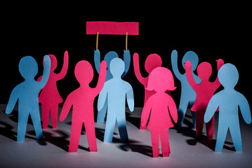 paper men with hands up holding tables with protests. The concept of freedom and independence,...