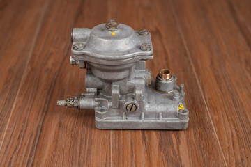 Part of an automotive diesel injection pump. Old style high pressure diesel pump cover with bushing exposed.