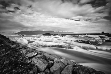 Jokulsarlon glacier lagoon in Iceland. Long exposure shot makes, black and white, vintage