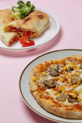 Small homemade vegetarian pizza with mushrooms and sweet corn