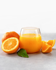 Fototapeta na wymiar Freshly squeezed orange juice in a glass