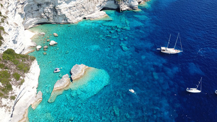 Aerial drone ultra wide photo of tropical Caribbean bay with white sand beach and beautiful turquoise and sapphire clear sea