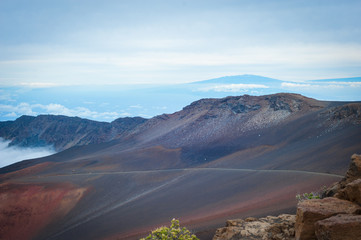 Fototapeta premium Volcano crater area, Haleakala, Maui, Hawaii - The island of Hawaii, Big Island in distance