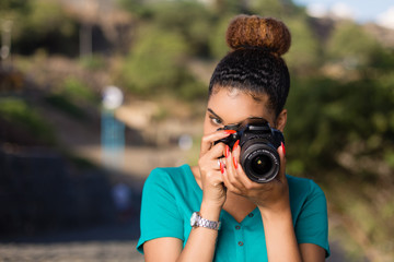 African American woman  photographer taking outdoor photos -  Black people
