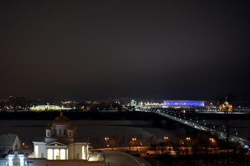 Fototapeta na wymiar View of the stadium and the beautiful Orthodox Church. Nizhny Novgorod. Russia