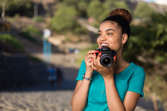 African American woman  photographer taking outdoor photos -  Black people