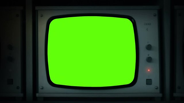 Hand Turns On Empty TV Monitor Green Screen