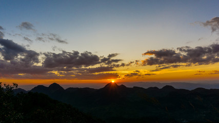 Mountain sunset light with green tropical forest nature landscape