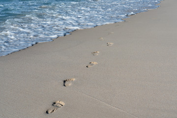 Beach sand footsteps on the beach