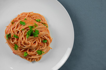 Spaghetti in red sauce with pork ham