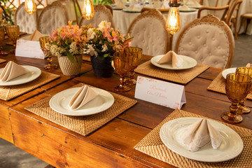 Wedding Setup. Banquet with table and chairs. Decoration, flowers, ware, glass