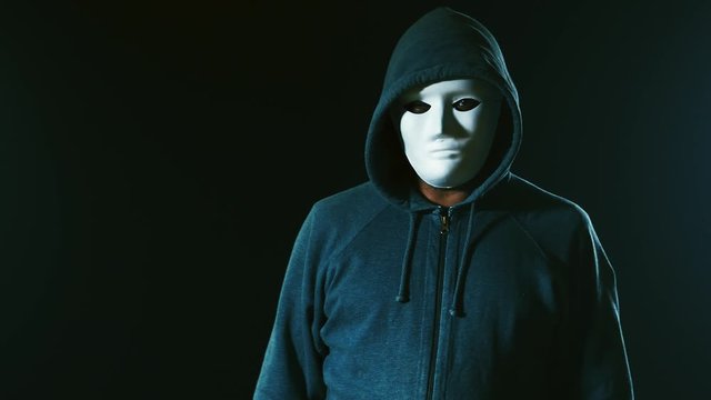 Scary killer in mask and hoodie