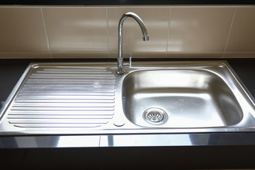 water faucet closed and empty stainless sink cooking in kitchen room