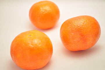Three Fresh Mandarines on white background