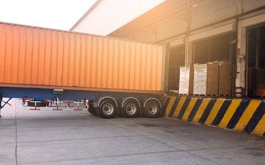 Truck docking load shipment goods at warehouse, road freight industry logistics and transport