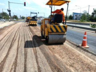 Blurred images of compactors to repair road surface