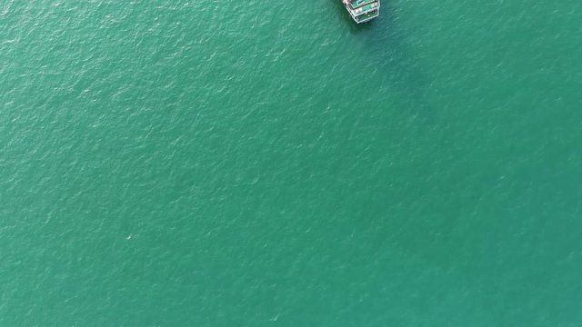 Aerial top view of the ship carrying the lpg and oil tanker in the sea port with vessel logistics. For energy export and import business for transportation trade. footage video 4k B-roll scene.