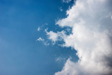 Obraz premium Beautiful blue sky and white fluffy clouds, Vibrant color sky with cloud on a sunny day, The morning sky with clouds in various shapes, Beautiful natural cirrus cloud background.