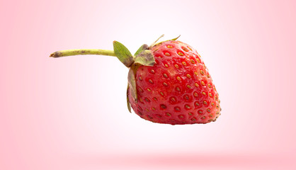 Red strawberry isolated on gradients yellow and white background with clipping path