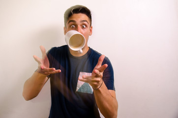 Young man with a jug in the air