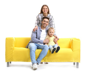 Fototapeta na wymiar Happy young family with sofa on white background