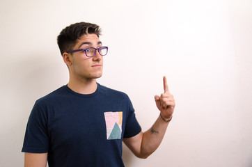 Young man pointing with his fingers