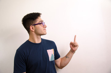 Young man pointing with his fingers