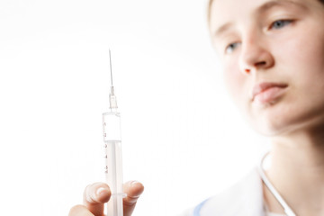 woman doctor with syringe in hand